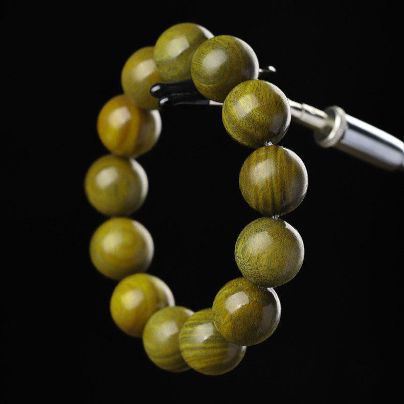 Xigura Patina handcrafted sandalwood bookmark, slow living setting for a warm, quiet home.