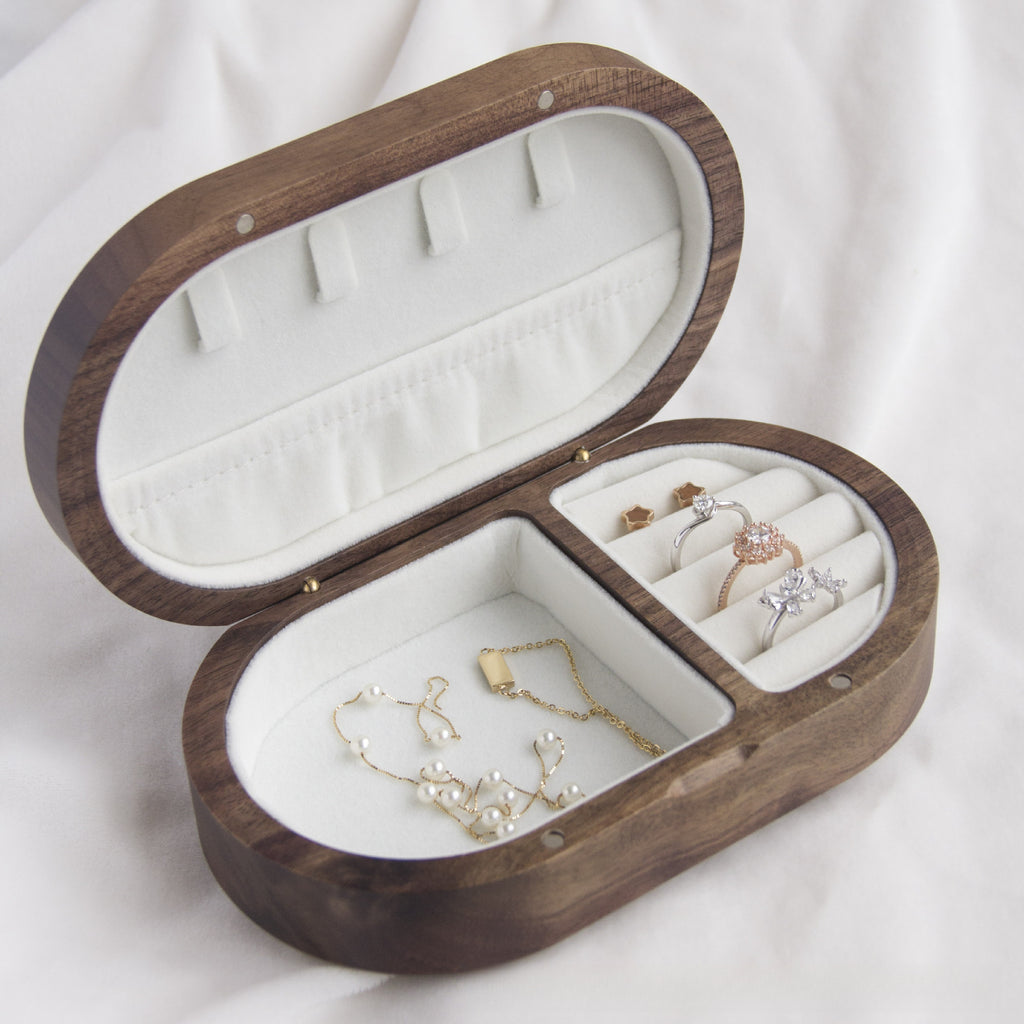 Xigura Patina handcrafted walnut jewelry box, main view in soft natural light for a warm, quiet home.