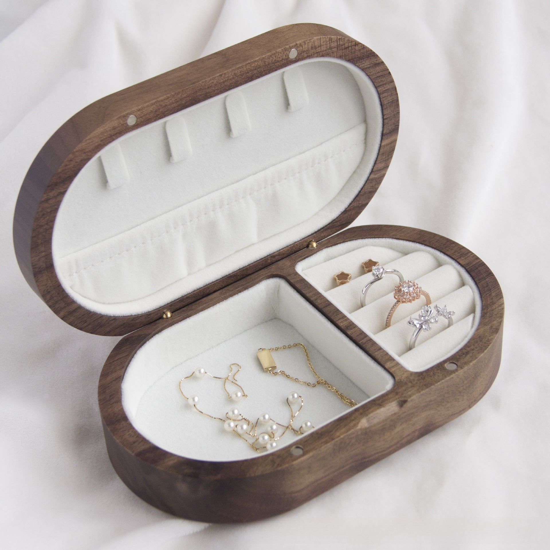 Xigura Patina handcrafted walnut jewelry box, main view in soft natural light for a warm, quiet home.