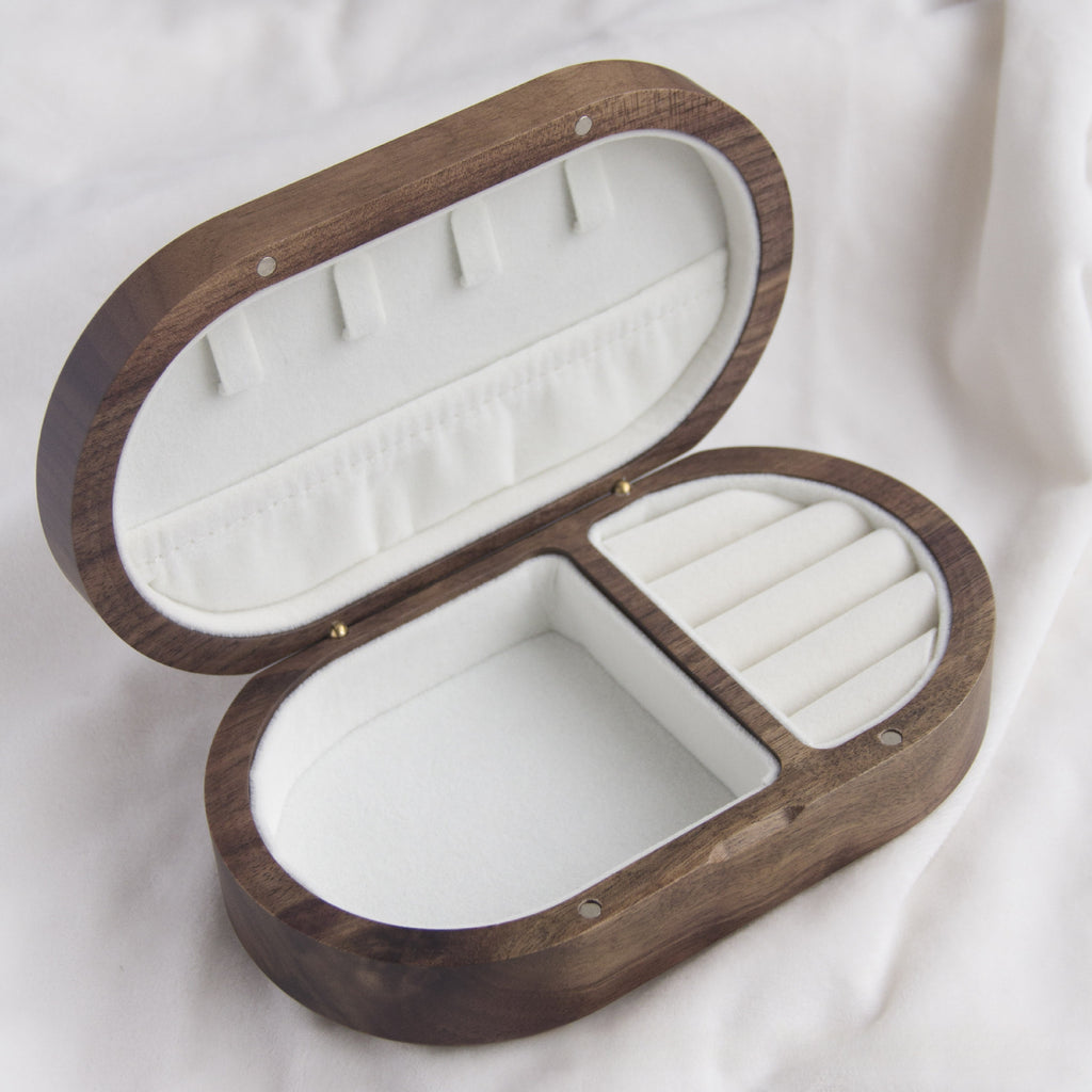 Xigura Patina handcrafted walnut jewelry box, natural grain detail for a warm, quiet home.
