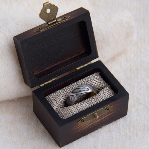 Xigura Patina handcrafted acacia jewelry box, main view in soft natural light for a warm, quiet home.