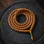 Xigura Patina handcrafted olive wood bracelet, main view in soft natural light for a warm, quiet home.