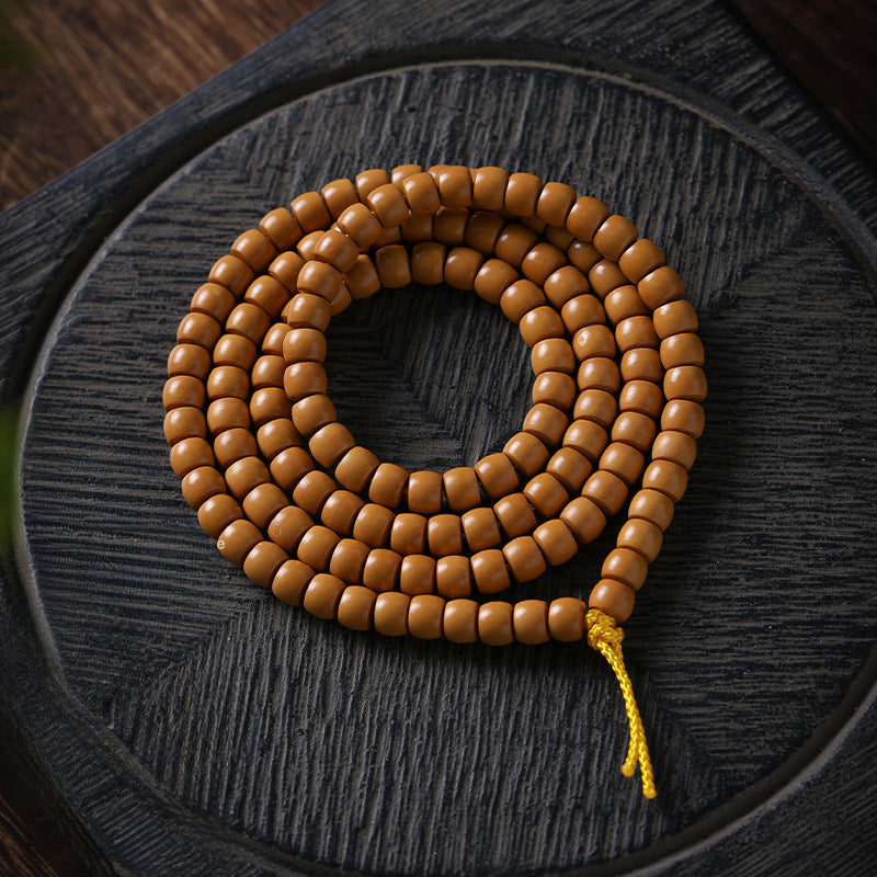 Xigura Patina handcrafted olive wood bracelet, main view in soft natural light for a warm, quiet home.