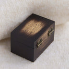Xigura Patina handcrafted acacia jewelry box, slow living setting for a warm, quiet home.