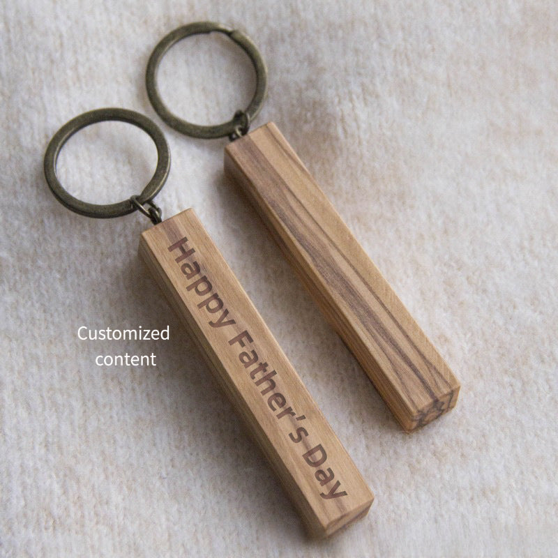 Xigura Patina handcrafted olive keychain, natural grain detail for a warm, quiet home.