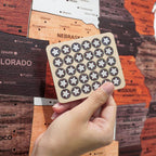 Xigura Patina handcrafted solid wood map puzzle, natural grain detail for a warm, quiet home.