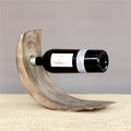 Xigura Patina handcrafted solid wood wine holder, main view in soft natural light for a warm, quiet home.