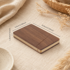 Black walnut business card holder styled on a desk in a warm workspace setting, showing its elegant and practical design.