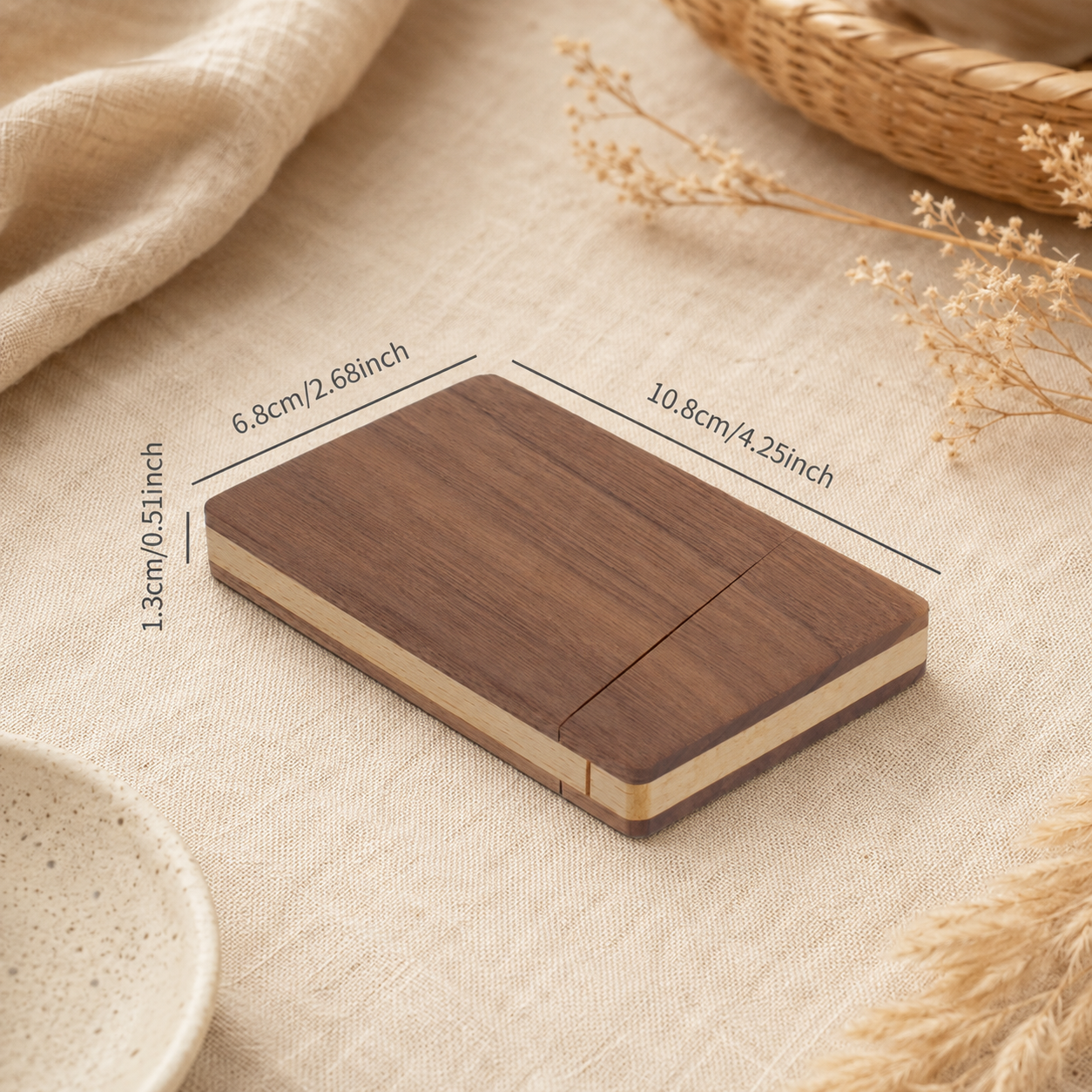 Black walnut business card holder styled on a desk in a warm workspace setting, showing its elegant and practical design.