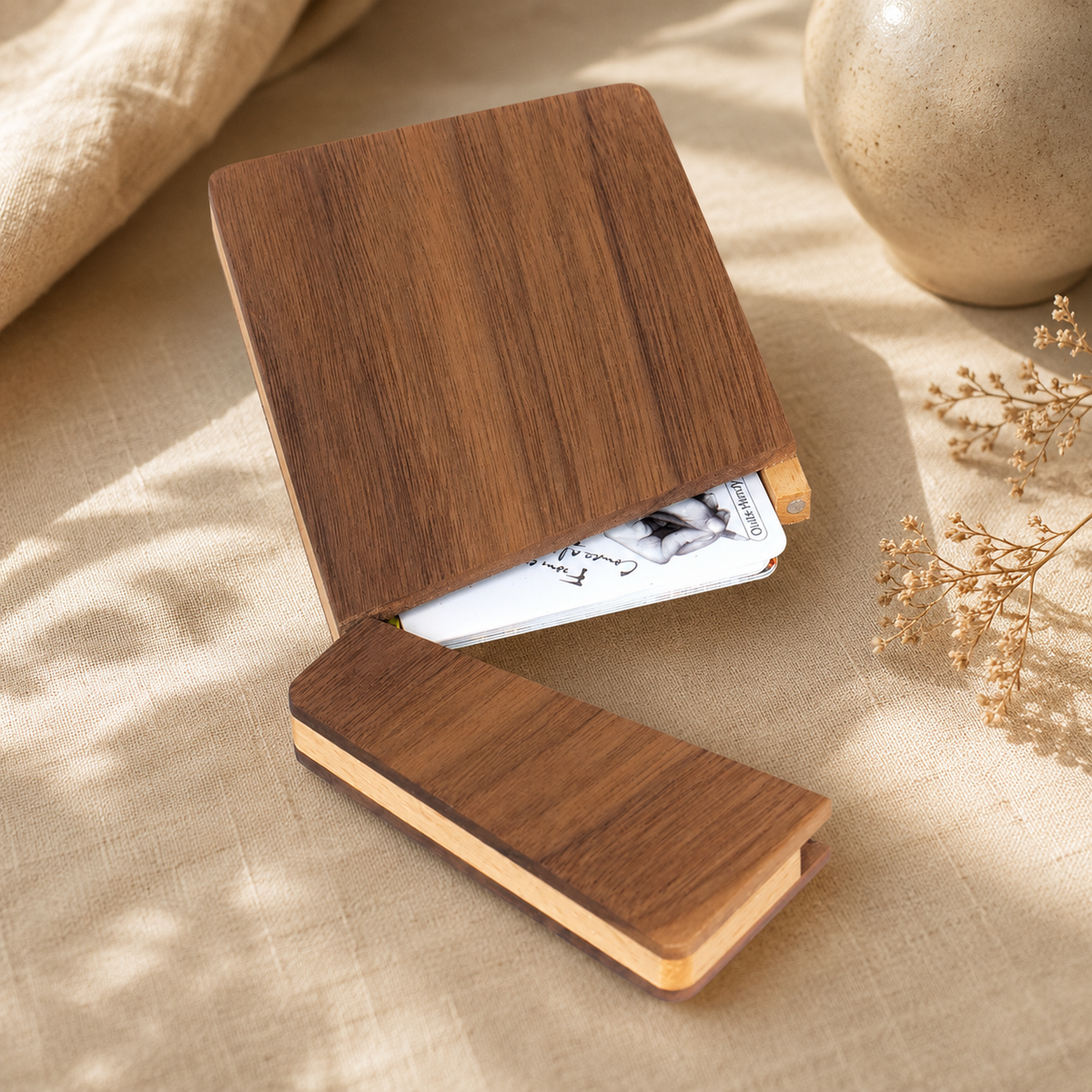 Close-up of the natural grain and smooth handcrafted edges of a solid black walnut business card holder.