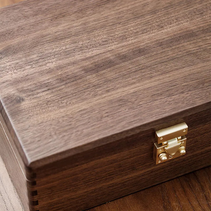 Black walnut keepsake box presented as a thoughtful gift for storing personal memories and meaningful belongings.