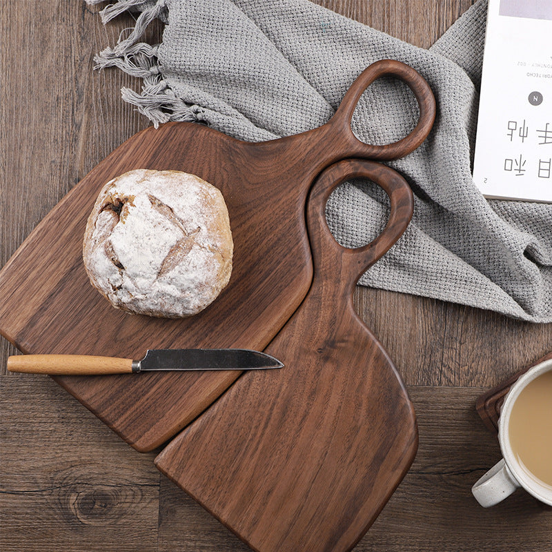 Handcrafted black walnut serving board set with natural wood grain for bread, cheese, charcuterie, and everyday serving.