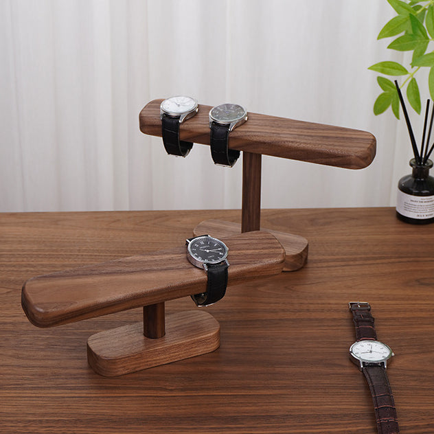 Close-up of a handcrafted black walnut watch stand showing the natural grain and smooth hand-sanded finish.
