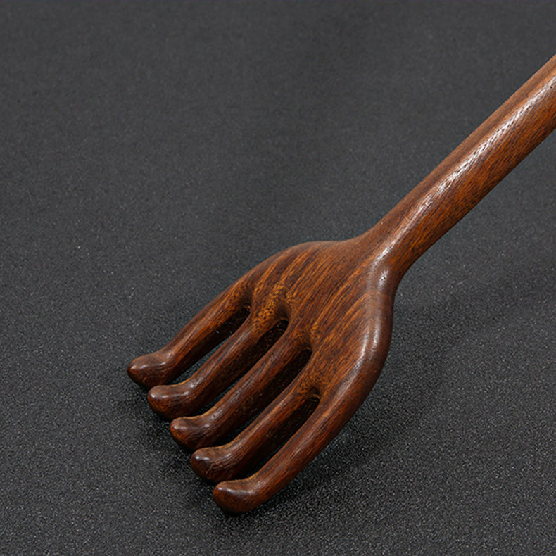 Close-up detail of handcrafted wooden back scratcher smooth finish