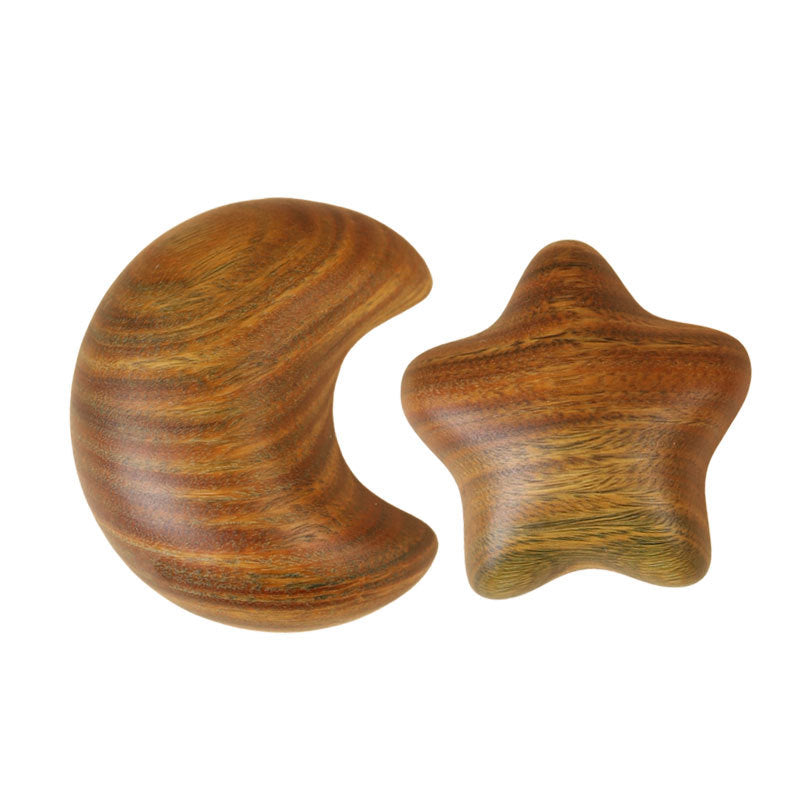 Close-up detail of handcrafted wooden moon and star with smooth finish