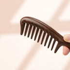 Close-up detail of handcrafted wooden teeth comb texture