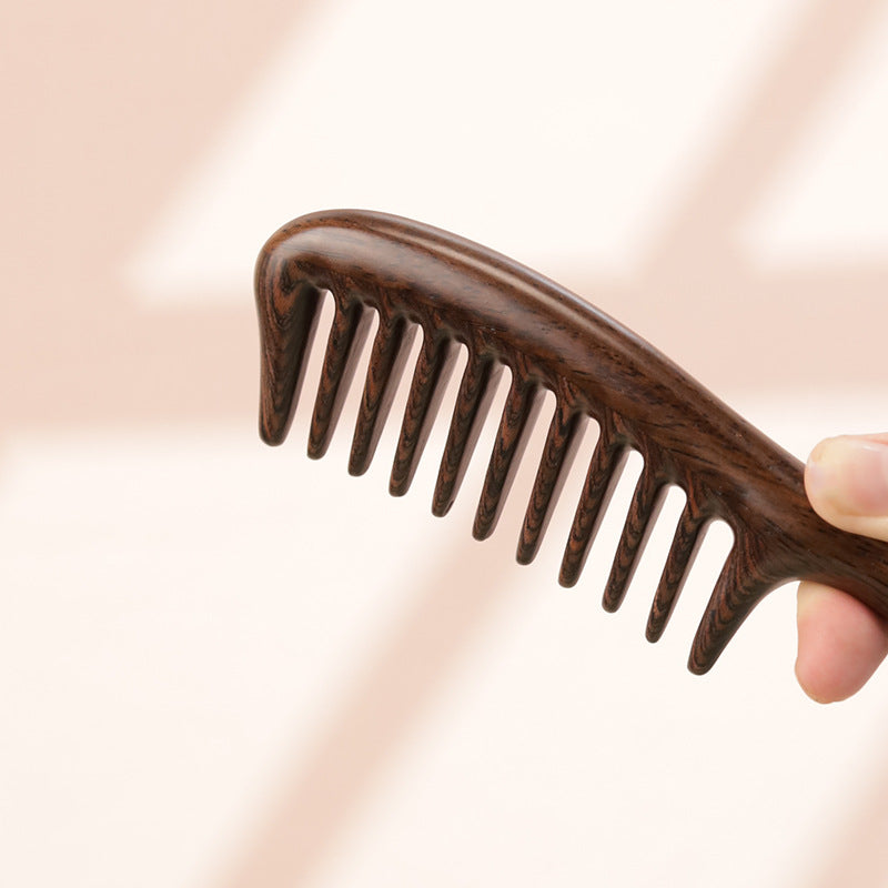 Close-up detail of handcrafted wooden teeth comb texture