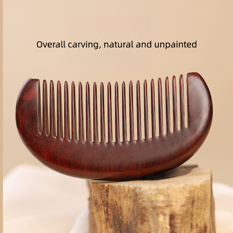 Close-up of handcrafted wood beard comb teeth and smooth finish