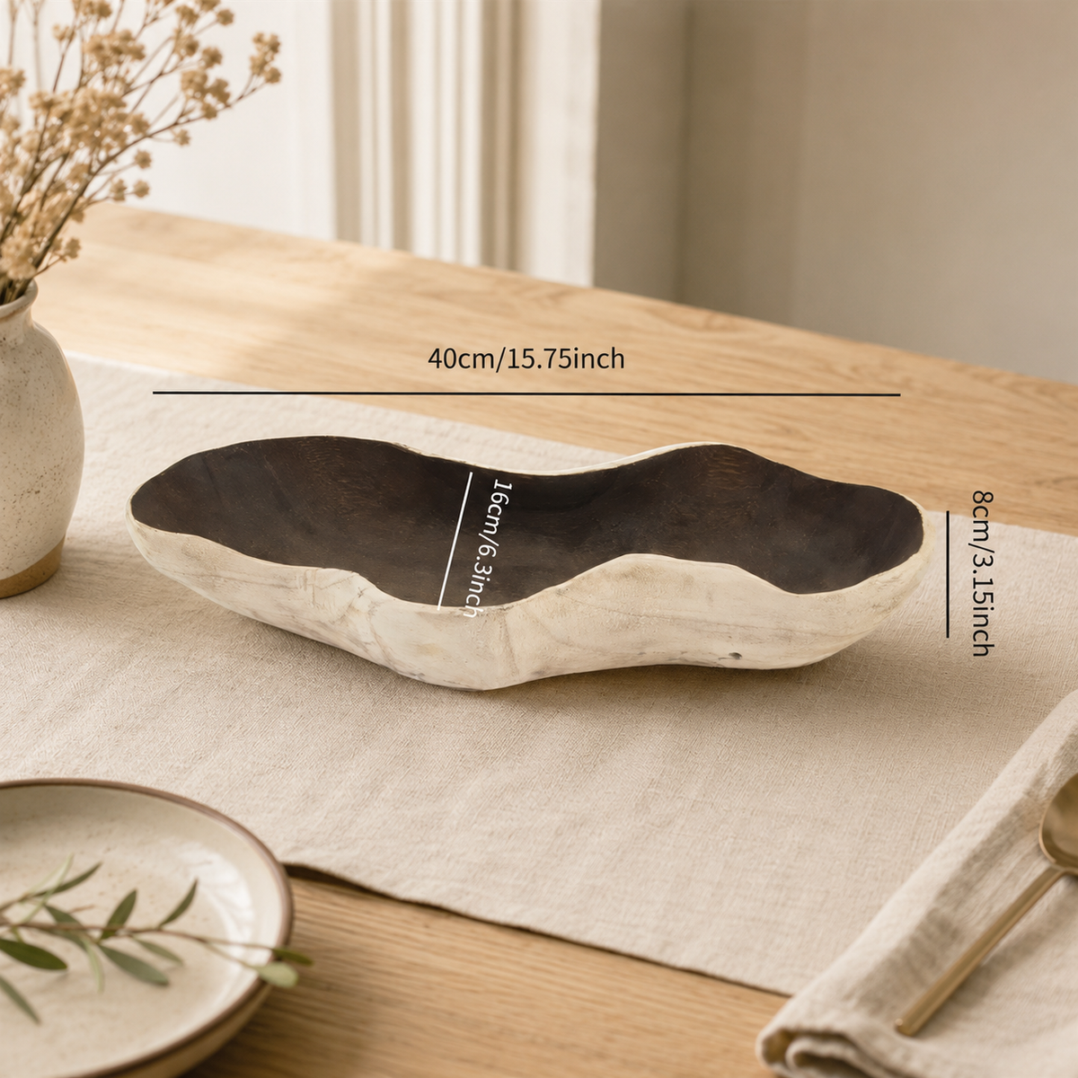Close-up detail of the handcrafted paulownia wood fruit tray, highlighting the natural grain, texture, and artisan finish.