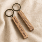 Handmade olive wood keychain presented as a personalized gift for loved ones with a natural rustic style.