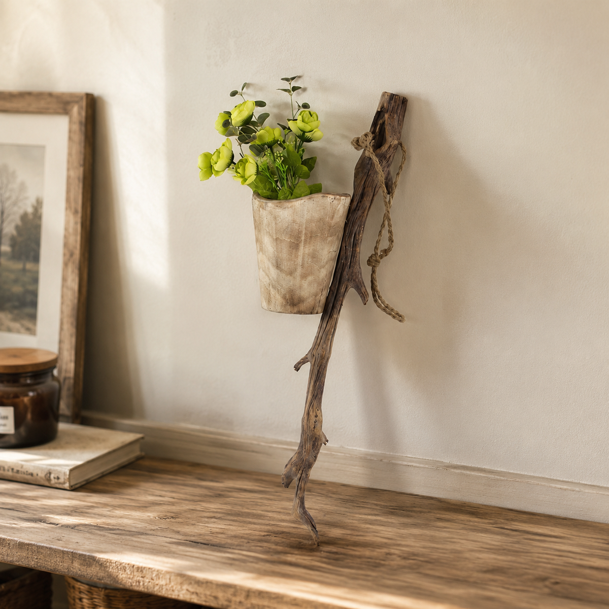 Handmade paulownia wood hanging planter with green plants displayed on a wall, showing its natural texture and rustic home decor style.