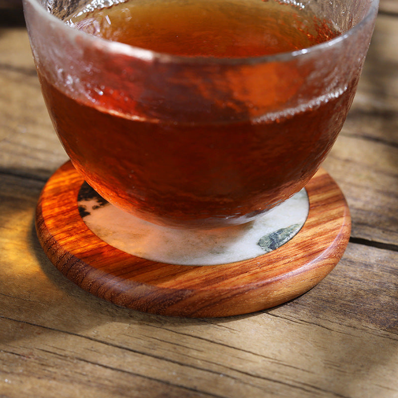 Handmade solid wood and marble coaster with natural grain texture