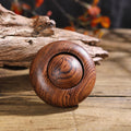 Handmade solid wood finger spinner with natural grain texture