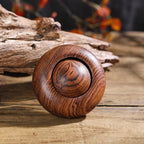 Handmade solid wood finger spinner with natural grain texture