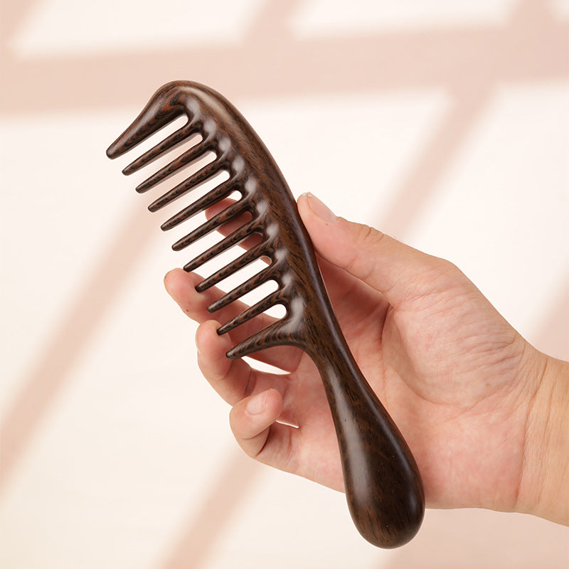 Handmade solid wood hair comb with natural grain texture