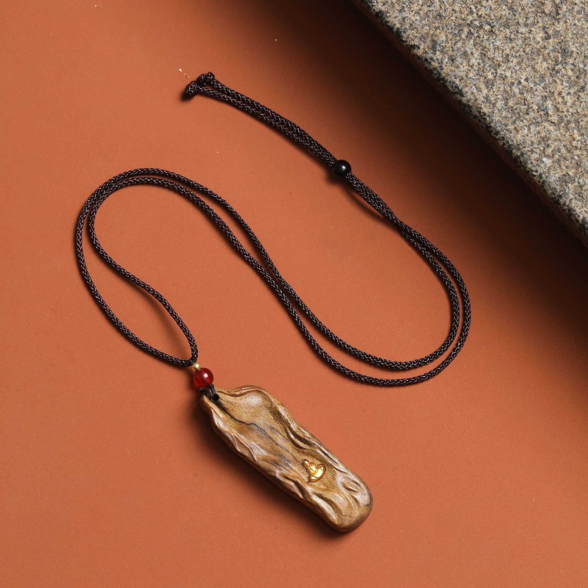 Handmade solid wood pendant necklace with natural wood grain