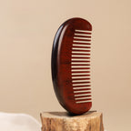 Minimalist wooden beard comb with natural grain texture detail