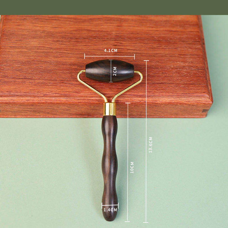 Minimalist wooden face roller with natural grain texture detail