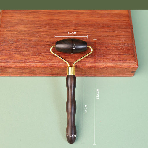Minimalist wooden face roller with natural grain texture detail