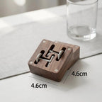 Open view of wooden cufflink storage box with organized compartments
