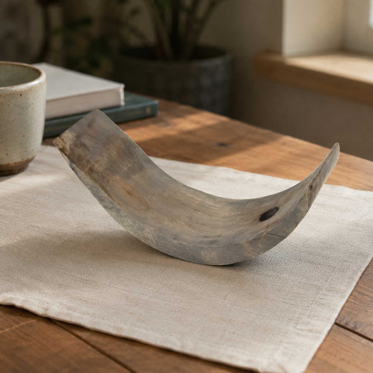 Side view of handcrafted paulownia wood wine rack featuring an organic shape and natural wood character.