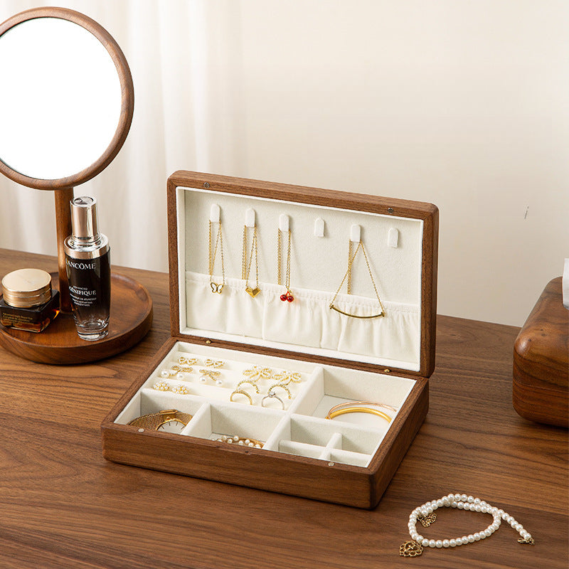 Handcrafted personalized black walnut jewelry box with compartments for rings, necklaces, bracelets, and earrings.