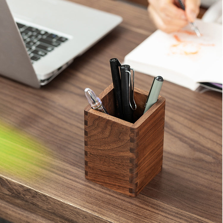 Side view of handcrafted black walnut pen holder for organizing pens and pencils.