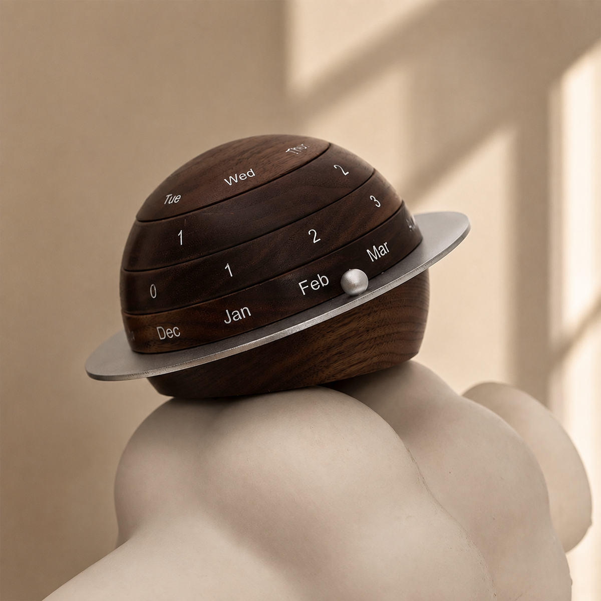 Close-up of the handcrafted black walnut perpetual calendar highlighting its smooth finish, engraved markings, and natural wood grain.