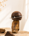 Personalized black walnut perpetual calendar with rotating wooden rings for displaying the day, date, and month in a timeless minimalist design.