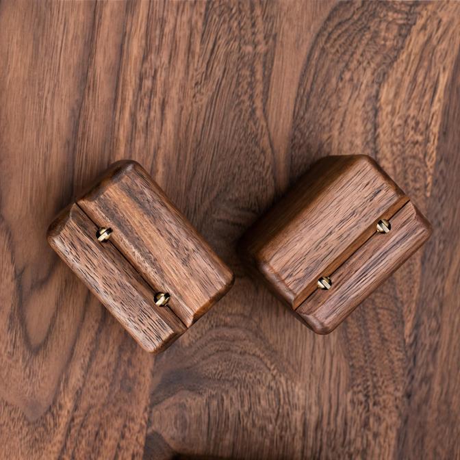 Close-up of a handcrafted black walnut ring box highlighting the natural grain and smooth hand-sanded finish.