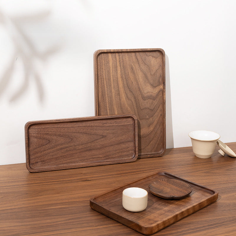 Close-up of handcrafted black walnut serving tray showing smooth hand-sanded finish and natural wood grain.