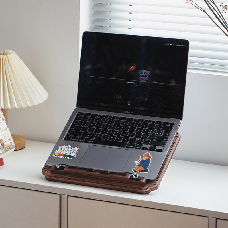 Solid black walnut wood book stand displayed in a cozy reading space with warm natural light.