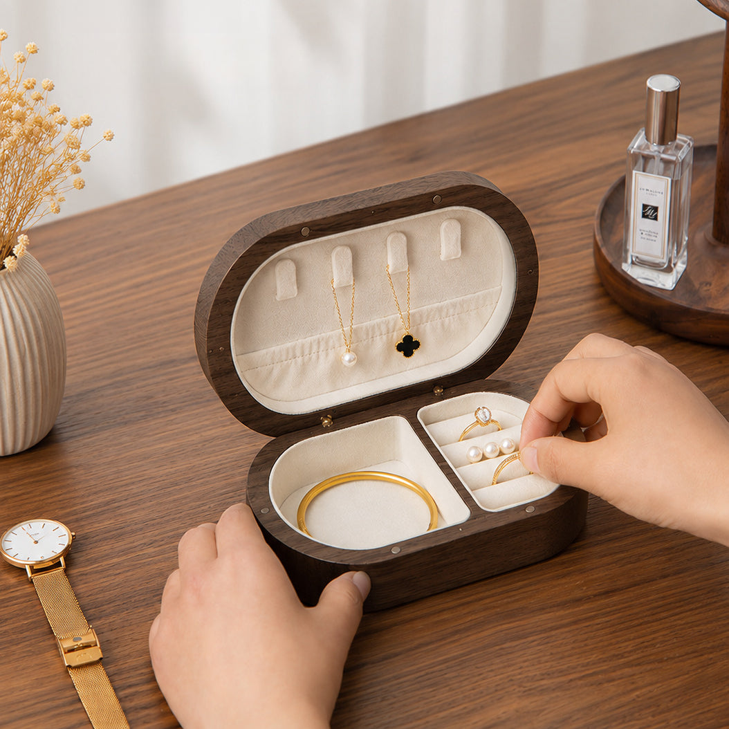 Close-up of the soft velvet-lined interior with dedicated compartments for rings, necklaces, earrings, and bracelets.