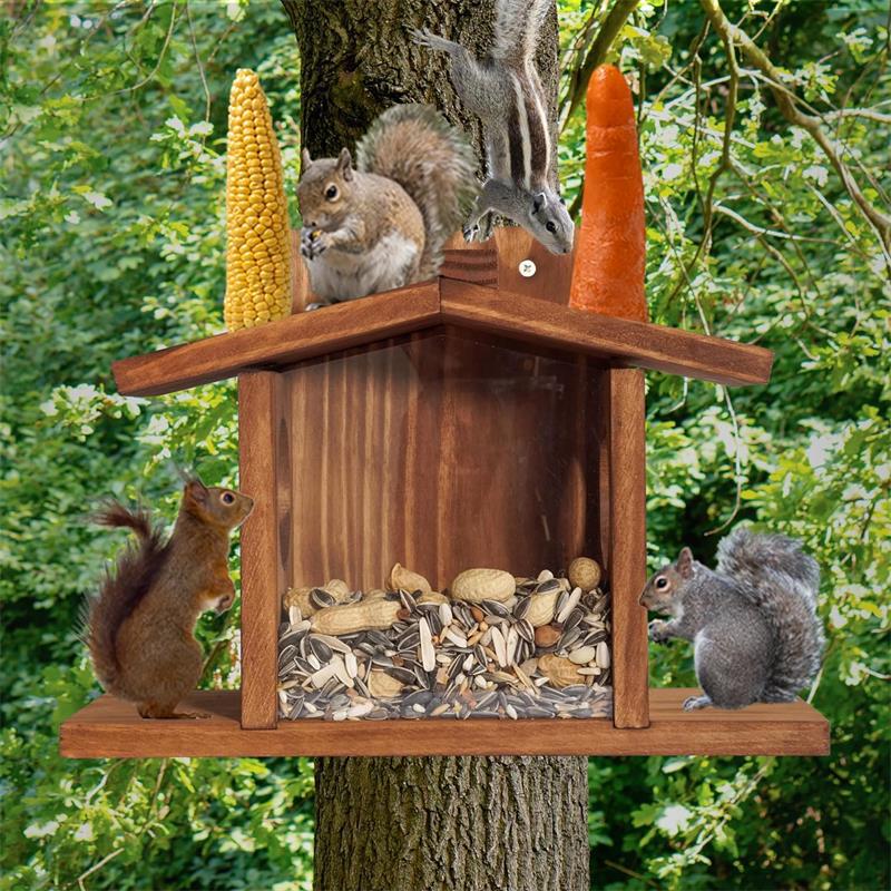 Squirrels enjoying nuts and seeds from a handcrafted wooden squirrel feeder outdoors.