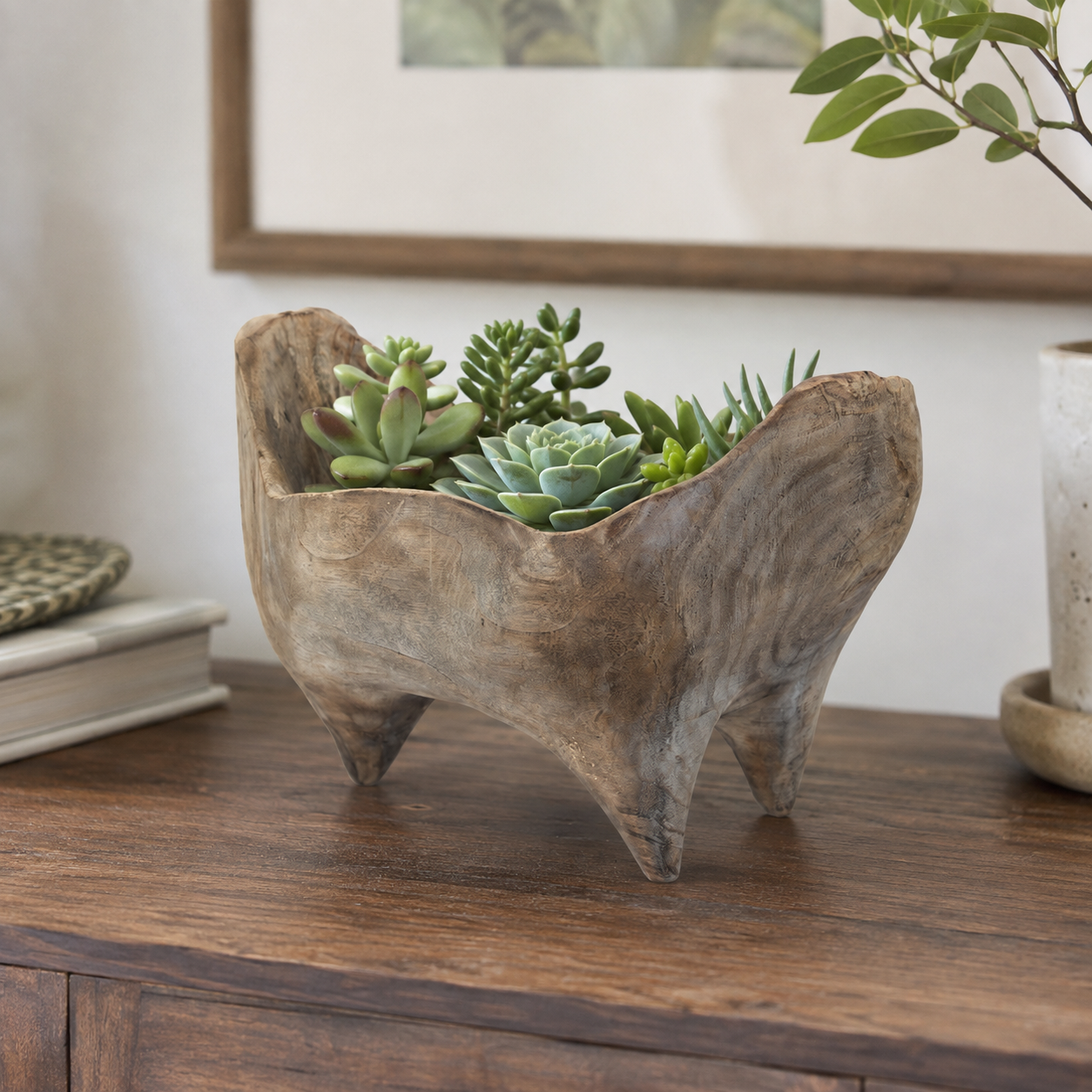 Rustic handcrafted wooden fruit bowl shown from a clear angle to illustrate its overall proportions and distinctive organic form.
