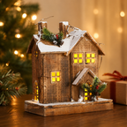 Side view of the handcrafted wooden Christmas cottage showcasing its handcrafted construction and charming winter design.