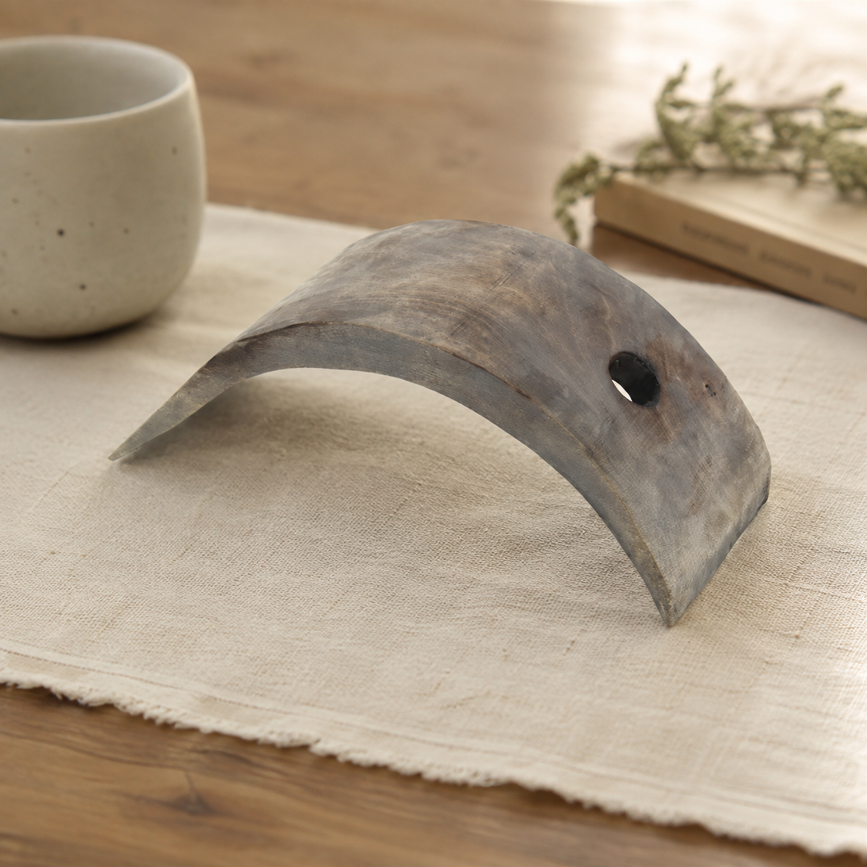 Rustic wooden wine bottle holder designed for countertop wine storage, adding a natural handmade touch to home decor.