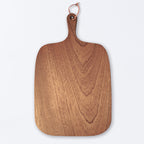 Rustic wooden serving board for steak, bread, and everyday dining