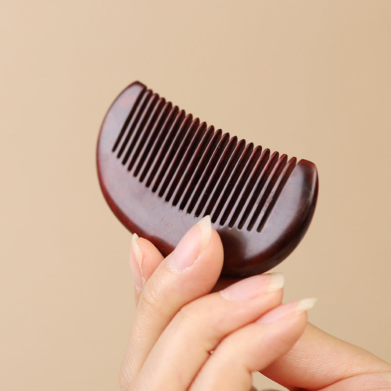 Wabi-sabi style solid wood beard comb in soft natural lighting