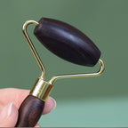 Wabi-sabi style solid wood face massage tool in soft lighting
